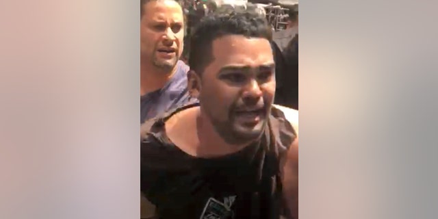 In this image made from video provided by Oscar Navarro Reyes, Richard Rojas is arrested after a fatal automobile accident on New York City's Times Square, Thursday, May 18, 2017. Authorities and witnesses said Rojas drove his car the wrong way up a Times Square street and plowed into pedestrians on the sidewalk. (Oscar Navarro Reyes via AP)