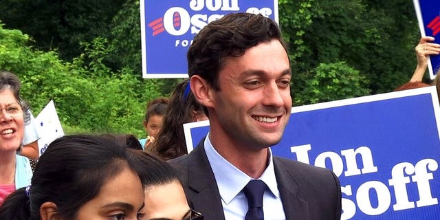 Democrat Jon Ossoff poses for a picture with supporters outside of the East Roswell Library in Roswell, Ga., Tuesday, May 30, 2017. Early voting has begun in the nationally watched special congressional race in Georgia. Ossoff is trying for an upset over Republican Karen Handel in the GOP-leaning 6th Congressional District that stretches across greater Atlanta's northern suburbs. (AP Photo/Alex Sanz)