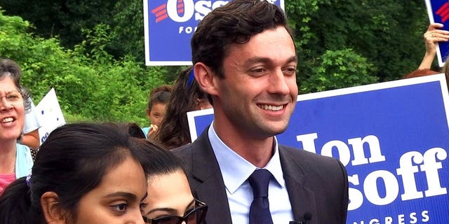 Democrat Jon Ossoff poses for a picture with supporters outside of the East Roswell Library in Roswell, Ga., Tuesday, May 30, 2017. Early voting has begun in the nationally watched special congressional race in Georgia. Ossoff is trying for an upset over Republican Karen Handel in the GOP-leaning 6th Congressional District that stretches across greater Atlanta's northern suburbs. (AP Photo/Alex Sanz)