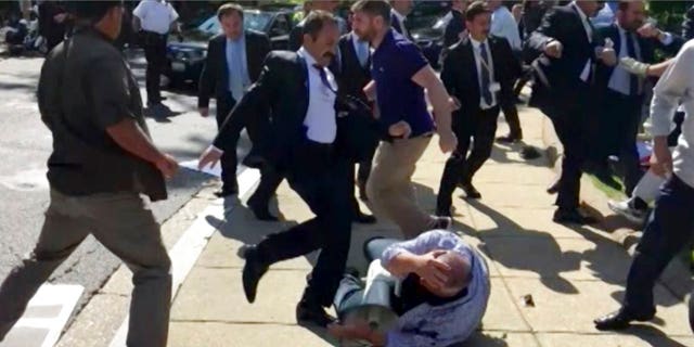Members of Turkish President Recep Tayyip Erdogan's security detail are shown attacking peaceful protesters during Erdogan's trip to Washington in May.