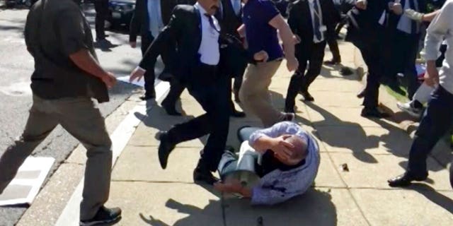 Members of Turkish President Recep Tayyip Erdogan's security detail are shown attacking peaceful protesters during Erdogan's trip to Washington in May.