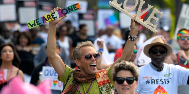 Marchers celebrate during the Los Angeles LGBTQ #ResistMarch, Sunday, June 11, 2017, in West Hollywood, California.