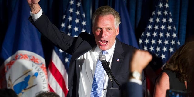Virginia Gov. Terry McAuliffe celebrates Democratic candidate for governor Ralph Northam's primary win at a Democratic primary election party in Crystal City, Va., Tuesday, June 13, 2017. (AP Photo/Cliff Owen)