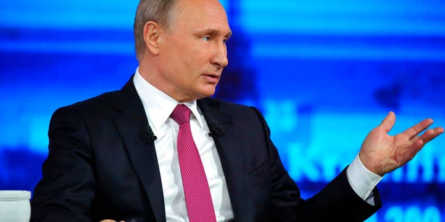 Russian President Vladimir Putin gestures during his annual televised call-in show in Moscow on Thursday, June 15, 2017. President Vladimir Putin has voiced hope for normalizing Russia-U.S. ties. (Mikhail Klimentyev/Sputnik, Kremlin Pool Photo via AP)