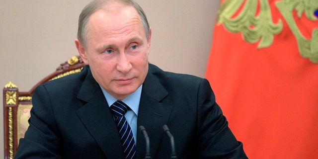 Russian President Vladimir Putin chairs a Security Council meeting in Moscow, Russia, Friday, June 16, 2017. The meeting was focused on the Russian military's claim that it had killed the Islamic State group's leader in an airstrike in Syria. (Alexei Druzhinin/Pool Photo via AP)