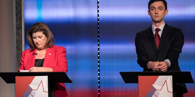 FILE - In this June 6, 2017 file photo, candidates in Georgia's 6th Congressional District race Republican Karen Handel, left, and Democrat Jon Ossoff prepare to debate in Atlanta. Handel and Ossoff are making their last push this weekend before voters in Georgias 6th Congressional District cast ballots Tuesday, June 20, to replace Tom Price in Washington, a contest seen as an early political test for the Trump administration.
(Branden Camp/Atlanta Journal-Constitution via AP)