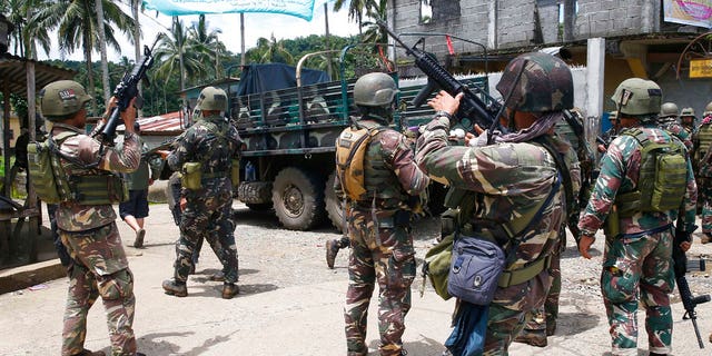 Philippines government troops prepare to head to the frontline as fighting with Muslim militants in Marawi city enters its second week in southern Philippines.