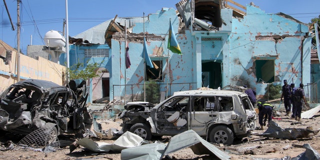 Somali security forces attend the scene of a car bomb attack in Mogadishu, Somalia Tuesday, June 20, 2017.