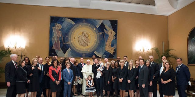 Pope Francis poses for a family picture with an NFL Hall of Fame delegation during a private audience at the Vatican, Wednesday, June 21, 2017. (L'Osservatore Romano/Pool Photo via AP)