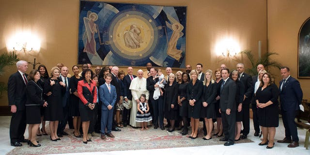 Pope Francis poses for a family picture with an NFL Hall of Fame delegation during a private audience at the Vatican, Wednesday, June 21, 2017. (L'Osservatore Romano/Pool Photo via AP)