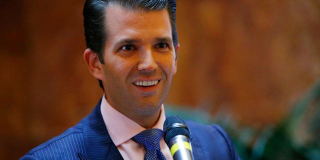 FILE - In this June 5, 2017, file photo, Donald Trump Jr., executive vice president of The Trump Organization, announces that the family's company is launching a new hotel chain inspired by his and brother Eric's Trump's travels with their father's campaign at Trump Tower in New York. Trump Jr. shared a video on July 8, 2017, of an edited clip of the 1986 military thriller âTop Gunâ in which President Donald Trumpâs face is superimposed over Tom Cruiseâs character as he shoots down a Russian jet with a CNN logo on it. (AP Photo/Kathy Willens, File)