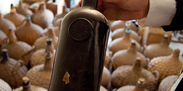 A six-month restoration project at Liberty Hall Museum in Union, N.J., uncovered three cases of Madeira wine dating to 1796 and about 42 demijohns from the 1820s while restoring its wine cellar. The museum said the monetary value of the wine cannot be made public. (David J. Del Grande/NJ Advance Media via AP)