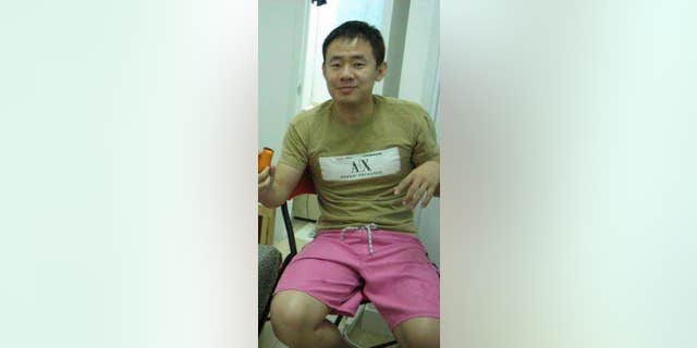 A 2009 handout photo shows Xiyue Wang at his apartment in Hong Kong, China.