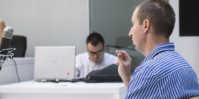 Alleged hacker Pyotr Levashov, speaks during a hearing to consider his extradition to the United States, at the National Court in Madrid.