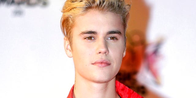 FILE - In this Nov. 7, 2015 file photo, Justin Bieber arrives at the Cannes festival palace in Cannes, southeastern France. Police say Bieber has accidentally struck a photographer with his pickup truck Wednesday night in Beverly Hills. (AP Photo/Lionel Cironneau, File)
