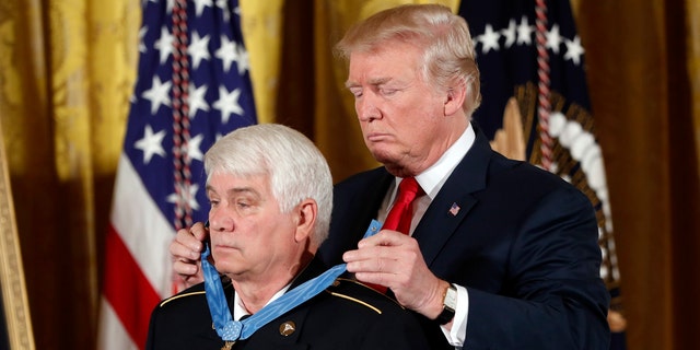 President Donald Trump bestows the nation's highest military honor, the Medal of Honor to retired Army medic James McCloughan during a ceremony in the East Room of the White House in Washington, Monday, July 31, 2017. McCloughan is credited with saving the lives of members of his platoon nearly 50 years ago in the Battle of Nui Yon Hill in Vietnam. (AP Photo/Pablo Martinez Monsivais)