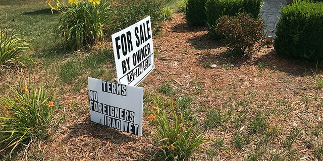 "No Foreigners" sign in front of James Prater's home in Mason, Mich.