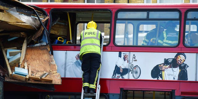 A red double-decker bus crashed into a London shop on Thursday.