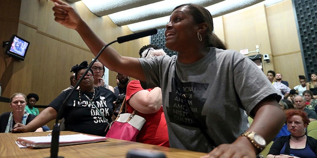 Tanesha Hudson addresses the Charlottesville City Council during a meeting.