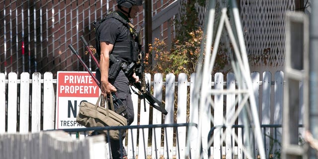 Law enforcement officers, including this Sacramento County sheriff's deputy on the scene of officer shooting Wednesday.
