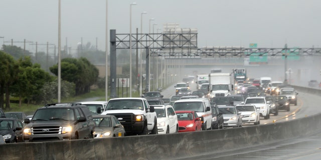 Northbound traffic on the turnpike near Sunrise Blvd. is backed up in the rain as motorist prepare for Hurricane Irma on Thursday, Sept. 7, 2017 in Sunrise, Fla.