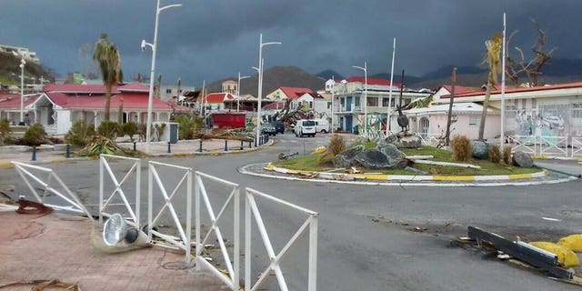 Debris covers the sidewalks of an empty downtown Marigot, on the island of St. Martin