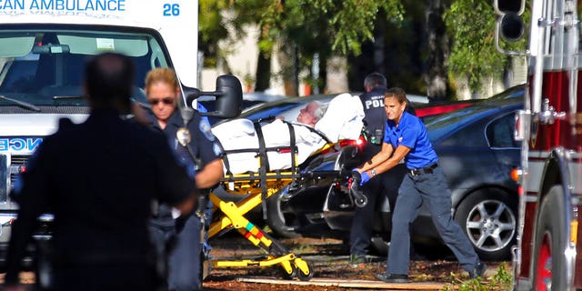 A woman is transported from the Rehabilitation Center at Hollywood Hills as patients are evacuated after a loss of air conditioning due to Hurricane Irma, Sept. 13, 2017, in Hollywood, Fla.
