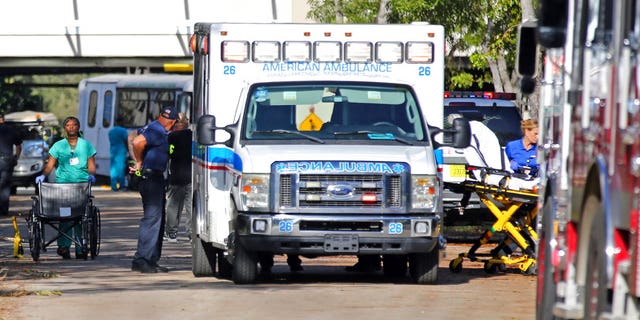 Patients evacuate the Rehabilitation Center at Hollywood Hills on Wednesday, Sept. 13, 2017.