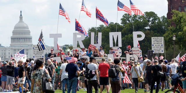 People gather on the National Mall in Washington, Saturday, Sept. 16, 2017, to attend a rally in support of President Donald Trump in what organizers are calling 'The Mother of All Rallies." (AP Photo/Susan Walsh)
