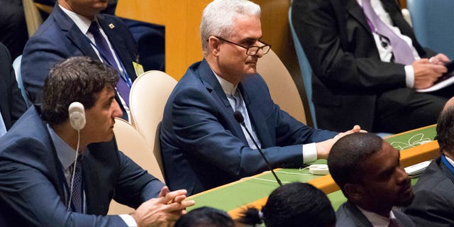 Members of the Iranian delegation listen as President Donald Trump speaks during the United Nations General Assembly in New York.