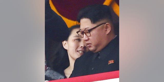 North Korean leader Kim Jong Un and his sister Kim Yo Jong watch a military parade at Kim Il Sung Square in Pyongyang.