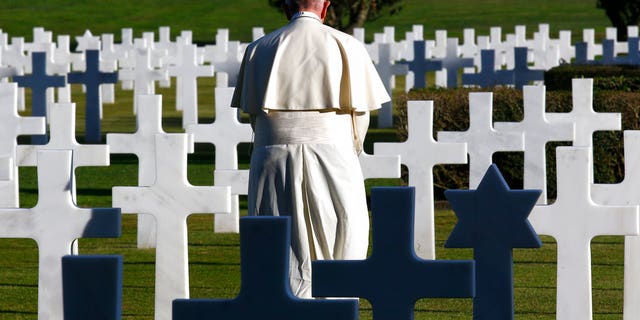 Mass was a celebration of the Day of the Dead, when the Italians celebrated the dead. The deity said the cemetery venue was a good place for an anti-war speech.