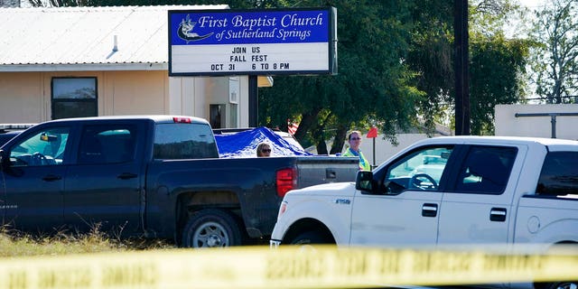 Law enforcement officers work in front of the First Baptist Church of Sutherland Springs after a fatal shooting, Sunday, Nov. 5, 2017, in Sutherland Springs, Texas.