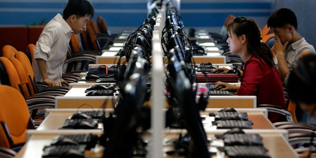 North Korean men and women use computer terminals at the Sci-Tech Complex in Pyongyang, North Korea, on June 16, 2017.