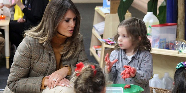First Lady Melania Trump plays with children at Joint Base Elmendorf-Richardson, Alaska, on Nov. 10, 2017