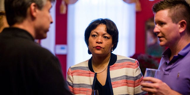 Democrat LaToya Cantrell, center, listens to campaign donors, Sept. 22, 2017.