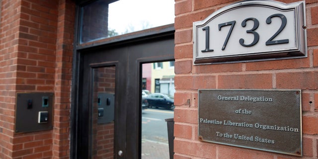 FILE- This Saturday, Nov. 18, 2017, file photo shows the Washington office of the Palestine Liberation Organization. Last week, U.S. officials said the Palestine Liberation Organization mission in Washington had to close because the Palestinians had violated a provision in U.S. law. But the State Department said Friday, Nov. 24, that the office can stay open, with restrictions. (AP Photo/Alex Brandon, File)