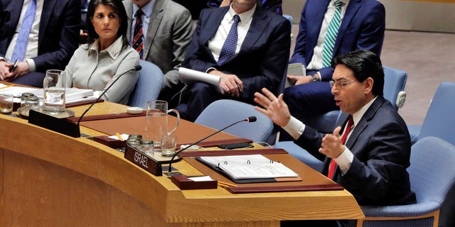 Israel's U.N. Ambassador Danny Dannon, right, speaks in the Security Council as U.S. Ambassador Nikki Haley, left, listens at United Nations headquarters, Friday, Dec. 8, 2017. (AP Photo/Richard Drew)
