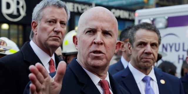 NYPD Commissioner James O'Neill, center, speaks at a Monday news conference urging New Yorkers to report suspicious activity.