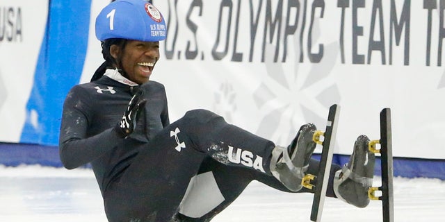Maame Biney falls as she wins the women's 500-meter A final race during the U.S. Olympic short track speedskating trials Saturday, Dec. 16, 2017, in Kearns, Utah.