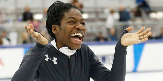 Maame Biney reacts during a medal ceremony after winning women's 500-meter A final race during the U.S. Olympic short track speedskating trials Saturday, Dec. 16, 2017, in Kearns, Utah. (AP Photo/Rick Bowmer)