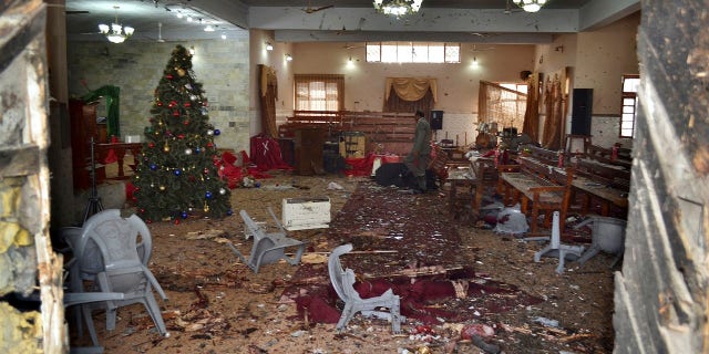 At least nine people were killed when two suicide bombers attacked the church during pre-Christmas service.