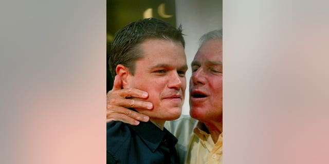 In this Sept. 5, 2004 file photo, Matt Damon is kissed by his father, Kent , before the screening of the film "The Bourne Supremacy" at the 30th American Film Festival of Deauville, Normandy, France.