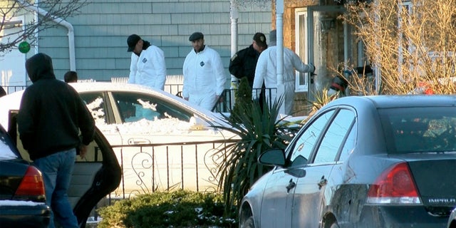 Authorities investigate outside a home in Long Branch, N.J., where a 16-year-old reportedly shot and killed his parents, sister and a family friend.