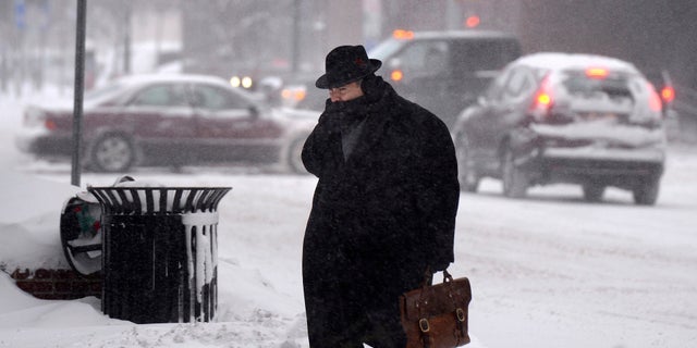 A man braving the frigid temperatures in Syracuse, N.Y.