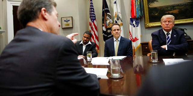 Kansas Gov. Sam Brownback, who resigned Thursday to take a Trump administration role, at a White House meeting with President Trump and other governors.