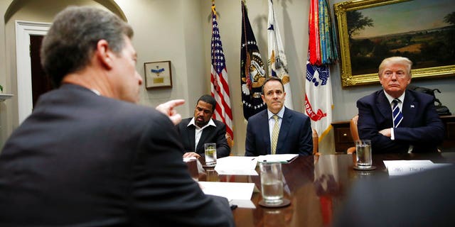 Kansas Gov. Sam Brownback, who resigned Thursday to take a Trump administration role, at a White House meeting with President Trump and other governors.
