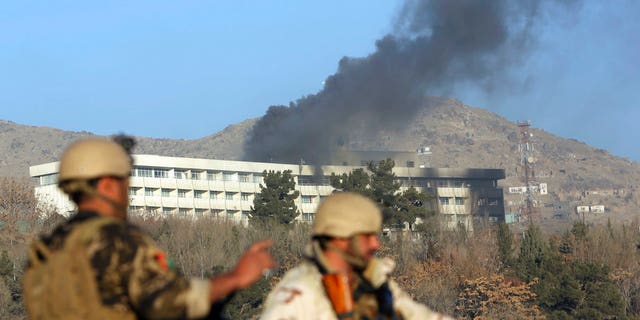 Black smoke rises from the Intercontinental Hotel in Kabul, Afghanistan, after gunman attacked the property last week.