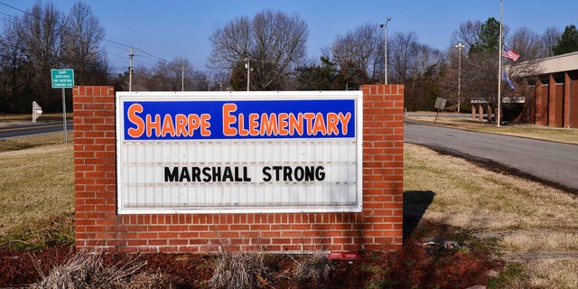 A sign displays "Marshall Strong" at Sharpe Elementary in Marshall County on Wednesday, Jan. 24, 2018, in Sharpe, Ky., a day after a fatal school shooting at nearby Marshall County High School.