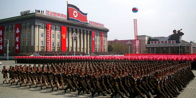 FILE - In this April 15, 2017, file photo, soldiers march across Kim Il Sung Square during a military parade in Pyongyang, North Korea. North Korea is preparing to stage a major event to mark the 70th anniversary of the founding of its military on Feb. 8, 2018 - just one day before the opening ceremony of the Pyeongchang Winter Olympics in South Korea. (AP Photo/Wong Maye-E, File)